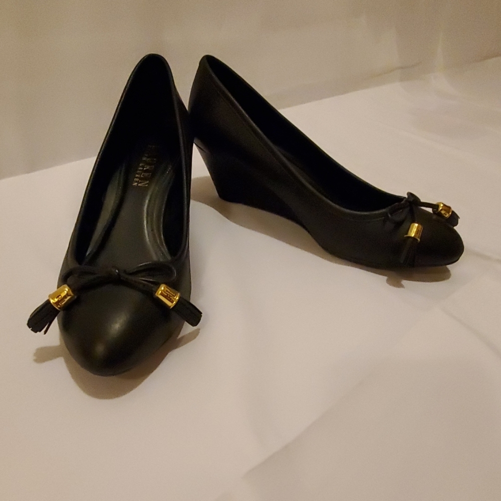 Black leather wedge pumps